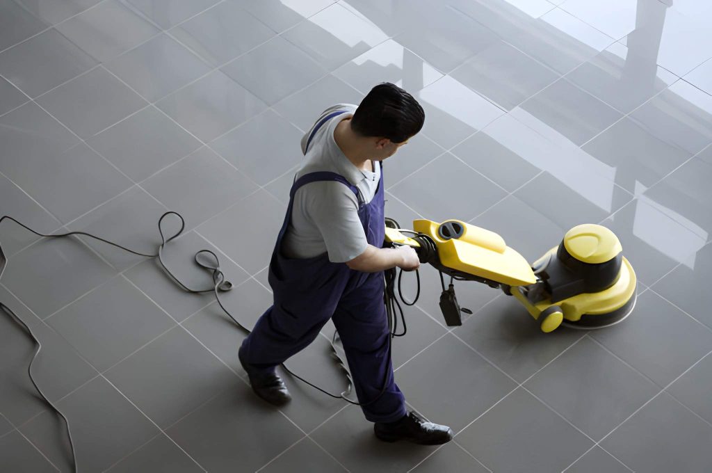 Tile cleaning Port Saint Lucie technician using floor buffer on glossy tiles for deep surface restoration.